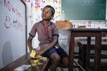 S. Hariraj, 8 years, assembles his foldscope.
