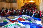 Several dozen demonstrators against a proposed liquid-natural gas pipeline and export terminal in Southern Oregon are seen crowding into the State Capitol building.