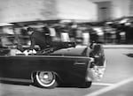 Secret Service agent Clint Hill rides on the back of the presidential limousine moments after President John F. Kennedy was shot on Nov. 22, 1963.