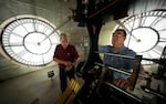 FILE- Chuck Roeser, right, and Don Bugh set the time forward on the historic clock tower atop the Dallas County Courthouse, March 7, 2024, in Dallas. The mechanical clock built in 1890 requires hand lubrication and reseting twice a year with daylight saving time.