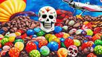 A sugar skull on a pile of candy.