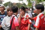 A schoolgirl cries outside her school where deaths and injuries were reported after a shooting in Thailand's Nonthaburi province, Friday, Aug. 7, 2026.