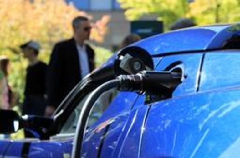 A Tesla is charging at PSU's new "Electric Avenue."