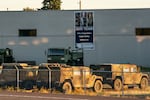 Military vehicles are seen at Camp Withycombe in Happy Valley, Ore. on Sunday, Oct. 5.