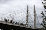 Members of the Proud Boys march across the Tilikum Crossing in downtown Portland, Ore., Saturday, Aug. 17, 2019. The Proud Boys, designated a hate group by the Southern Poverty Law Center, had organized a rally against antifascists.
