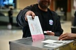 People vote at a polling station at Meadows Mall in Las Vegas on Tuesday. Nevada was one of several states to vote down election reform efforts.