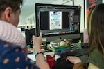 Jo Christensen, left, and Betsy Howitt work on digital art boards at Dark Horse headquarters in May.