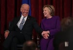 Joe Biden and Hillary Clinton, when they served as vice president and secretary of state, respectively, are seen here on Dec. 8, 2016. Biden is honoring Clinton and 18 others with the Medal of Honor.