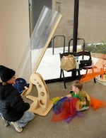 Lennon Arzner, 10, and Graham Segal, 3, play with the wind tunnel at the Central Oregon Children’s Museum pop-up event in Bend on Oct. 11, 2026.