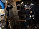 Counterprotesters try to dismantle a pro-Palestinian encampment set up on the University of California, Los Angeles campus in the early hours of Wednesday.