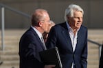 Michael Jeffries (right), former CEO of Abercrombie & Fitch, exits the federal courthouse after his arraignment on sex trafficking and interstate prostitution charges Oct. 25 in Central Islip, N.Y.