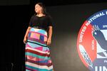 A model poses in a geometric print skirt designed by Red Berry Woman during the pre-gala fashion show during the 2024 UNITY Conference in Portland, Oregon on July 2.