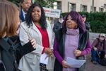 Wandrea "Shaye" Moss, second from left, and her mother Ruby Freeman, right, leave after speaking with reporters outside federal court, Friday, Dec. 15, 2023, in Washington. A jury awarded $148 million in damages on Friday to the two former Georgia election workers who sued Rudy Giuliani for defamation over lies he said about them in 2020 that upended their lives with racist threats and harassment.