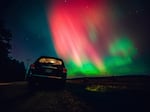 The night sky in Wisconsin glows with the northern lights as a geomagnetic storm brings vibrant pink and green colors to a majority of the northern states, and beyond.