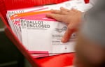 Poll workers process ballots for the 2020 presidential election at the Multnomah County elections office in Portland, Oregon, Nov. 2, 2020.