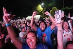 New York Knicks fans celebrate during a watch party inside Central Park during Game 4 of the NBA Finals basketball series between the Knicks and the San Antonio Spurs, Wednesday, June 10, 2026, in New York.
