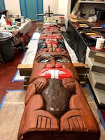 In this Nov. 17, 2018 photo a freshly-painted totem pole at the 4J NATIVES program shows a beaver and other animals.