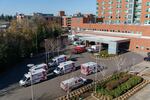 Emergency transport vehicles stack up outside the emergency department, waiting for patients to be admitted at Salem Health in Salem, Oregon, Jan. 27, 2022. The department has 53 patient rooms but has made space for 100 by adding hallbeds to handle the influx of people seeking treatment. 