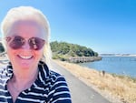 Novelist Holly Goldberg Sloan at the mouth of Siuslaw River on the Oregon Coast. Her new novel "Finding Lost" centers on a young girl who lost her father in a boating accident on the river.
