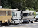 Vehicles housing residents along Martin Luther King Jr. Way in Seattle's Central District, Aug. 15, 2026.