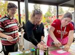 Pacific University students create stencil art with spray paint at a Pacific Votes event on Oct. 11, 2024. Sophomore GiGi Whisler, right, will vote for the first time this year.