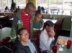 In this undated photo, courtesy of the Baskin family, Skye Baskin, in red, hugs his younger brother, Trai. Skye's sister, Gia Bouie, and brother, Ched Baskin are also pictured.