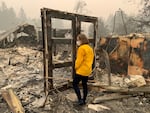 Oregon Gov. Kate Brown tours an area damaged by the Labor Day fires in September of last year.