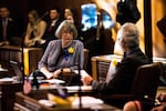 Oregon Sen. Ginny Burdick, D-Portland, speaks with Sen. Floyd Prozanski, D-South Lane and North Douglas counties, on the floor of the state Senate Monday, Jan. 14, 2019, in Salem, Ore.