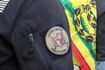 A militia patch on the arm of a protester in Burns, Oregon.