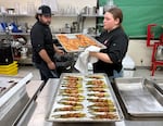 Culinary students Nick Dickson, left, and Zoey Koehler help prepare a Veterans Day lunch hosted at the Siletz Valley School in Siletz, Ore. on Nov. 6, 2025.