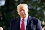 President Donald Trump speaks to the media before boarding Marine One on the South Lawn of the White House, Tuesday, Jan. 12, 2021 in Washington. The President is traveling to Texas.