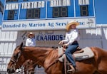 Anne Greaves, right, and her sister Georgia Greaves wait to participate in the opening of the St. Paul Rodeo on July 4, 2026 in St. Paul, Ore. The St. Paul Rodeo, a staple since 1936, draws thousands to the small community each year for its various sporting events and fair grounds.