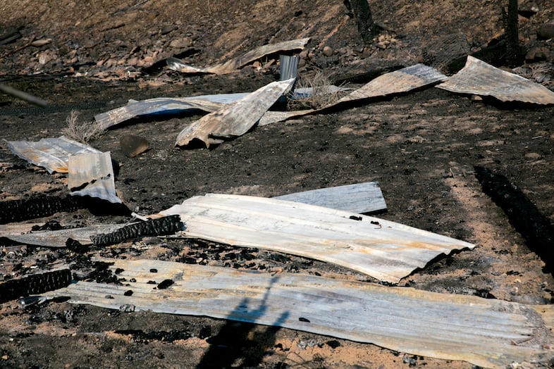 Charred remnants of a burned corral belonging to a neighbor of the Smulls in Rye Valley. 