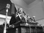 In this 1960 file photo, Rev. Martin Luther King Jr. speaks at a podium in Atlanta.