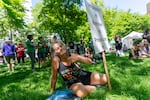 Margaret Hess rings her “bell of shame” as she attends a May Day rally, held at Portland State University, May 1, 2025 in Portland, Ore. Hess says she attends all the rallies she can. “We are fighting for our lives here. I don’t plan on sitting this one out.”