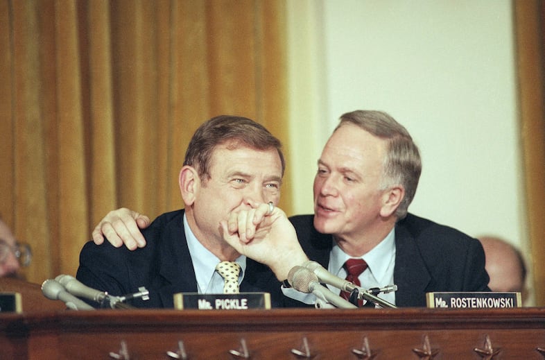 Sen. Bob Packwood, R-Ore., right, talks with Rep. Dan Rostenkowski, D-Ill., prior to approval of the most radical tax overhaul in a half-century, on Capitol Hill in Washington on Saturday, August 17, 1986. I am proud of the Congress and happy for the nation, Packwood said.