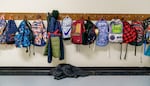 Backpacks line the hallway at Prescott Elementary in Northeast Portland, Feb. 8, 2022.