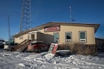 KYUK broadcasts out of a small tan building at the base of a tall tower in Bethel, Alaska — about 400 miles west of Anchorage.