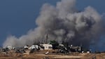 Smoke rises following an Israeli bombardment in the Gaza Strip, as seen from southern Israel, on Sunday.