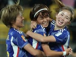Japanese midfielder Hinata Miyazawa, center, celebrates after scoring her team's third goal during its match against Spain earlier this week. Japan is one of three teams to win all its games in the group stage.