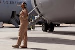 Staff Sgt. Krysteena Scales, a 816th Expeditionary Airlift Squadron Flying Crew Chief, performs pre-flight checks before departing on a mission in a C-17 Globemaster III in 2009.