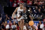 UC Irvine guard Deja Lee (13) drives next to Gonzaga forward Yvonne Ejim (15) during the second half of a first-round college basketball game in the women's NCAA Tournament in Spokane, Wash., Saturday, March 23, 2024.