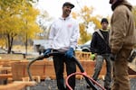 Joey Martin, owner of Collective Concrete, pours concrete into forms Nov. 1, 2022, during construction of the skate park. Martin has built skateparks all over the world.