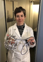 University of Oregon psychology professor Melynda Casement stands outside a sleep pod, with an EEG (electroencephalogram) set used to measure subjects' brainwaves. Casement came to the UO in the fall of 2016, with the sleep lab facility opening earlier this year.