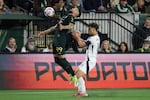 FILE — Portland Timbers' Kristoffer Velde (99) controls the ball ahead of Vancouver Whitecaps midfielder Sebastian Berhalter (16) during an MLS soccer match, Saturday, March 7, 2026, in Portland, Ore.