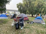 FILE: In September 2020, unsheltered people set up dozens of tents in Hawthorne Park in Medford as a form of protest against "clean sweeps" by city police.
