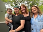 Jessica Katz, right, poses for a photo with Bre Gregg, center-right, Ada McGraw and McGraw's son Legend at OPB, May 5, 2026.