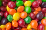 A lawsuit against Mars, the company that makes Skittles, points to titanium dioxide in the candy. The ingredient is one of thousands of additives allowed in foods under federal regulations.