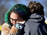 Jessy Smith Cruz embraces Jadzia Dax McClendon the morning after a mass shooting at Club Q, an LGBTQ nightclub in Colorado Springs, Colorado, on Sunday.