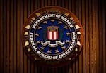 A seal of the FBI reads "Department of Justice Federal Bureau of Investigation"